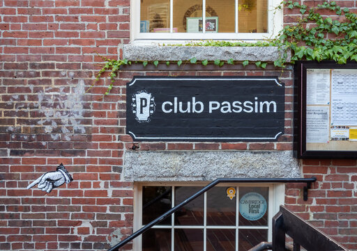 the front of Club Passim with stairway leading down to the door