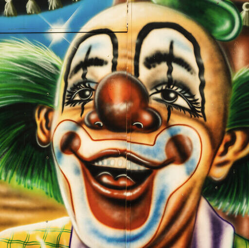 painting of a clown on a wall